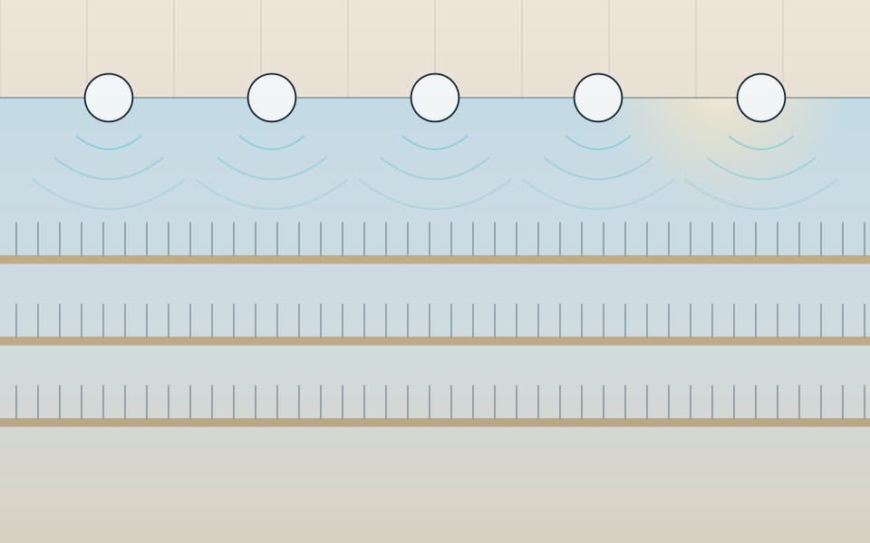 Ceiling speakers covering a multi-level atrium, in daylight